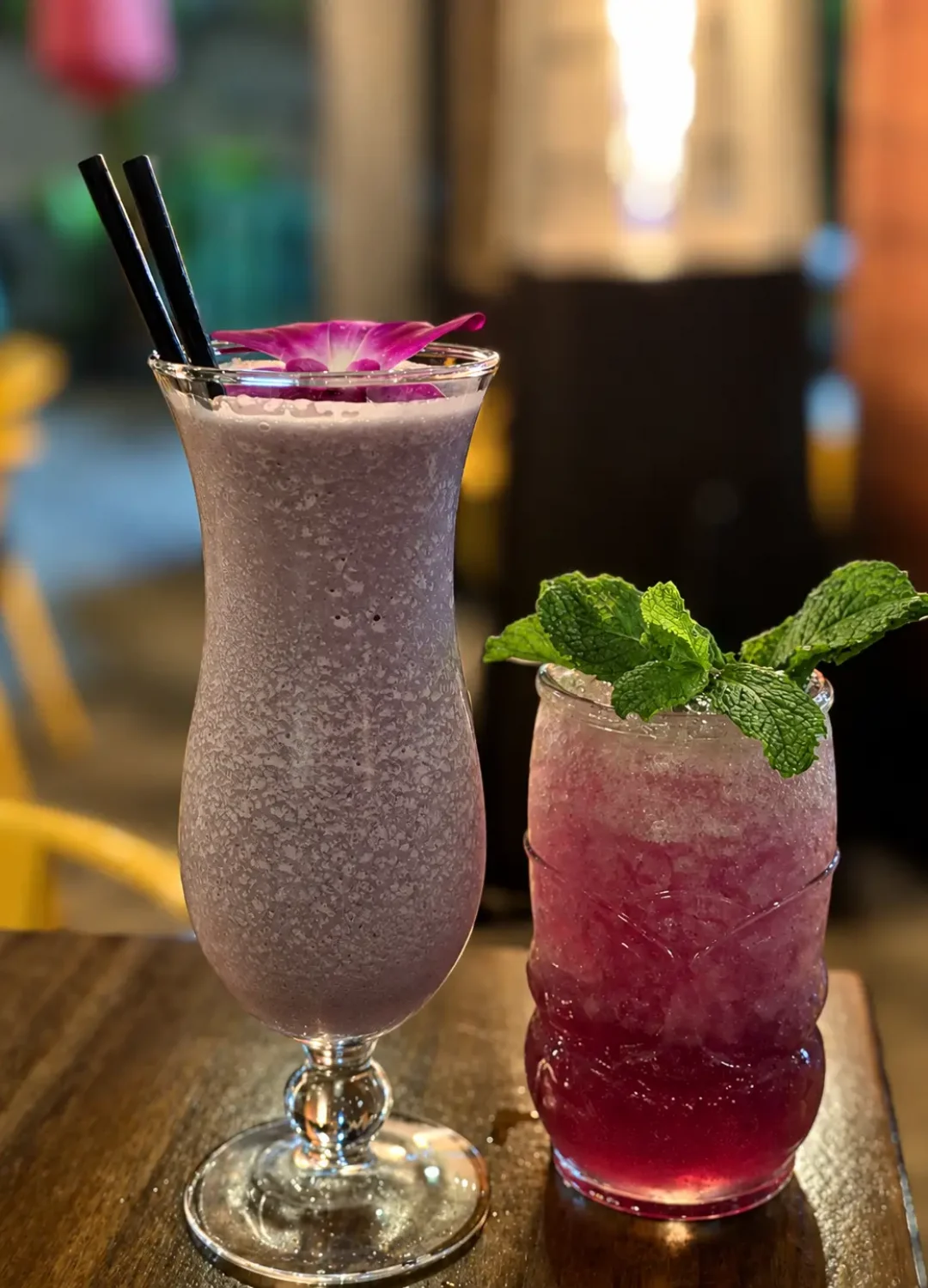 Two drinks with orchid and mint